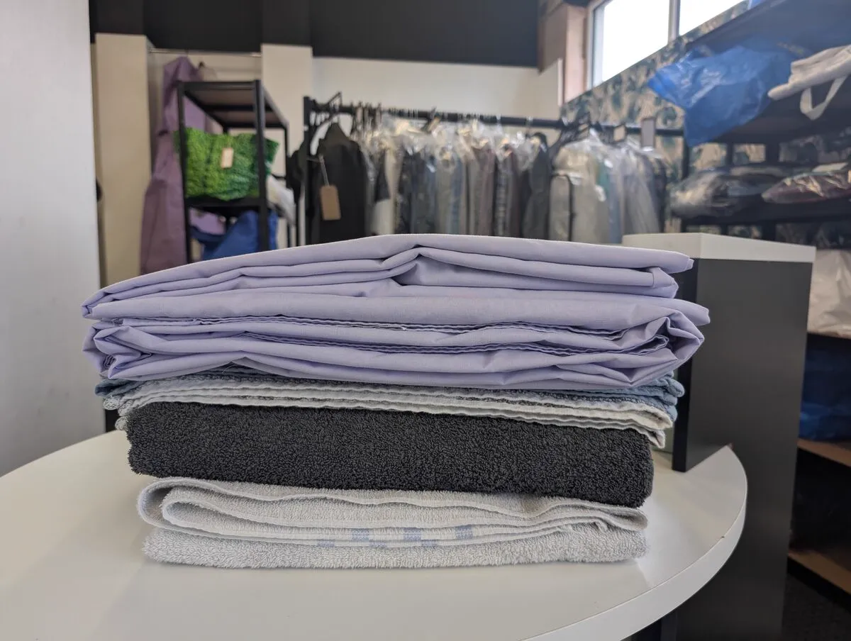 Freshly laundered and folded bedding and towels in our Walsall Wood shop